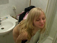 Fine blonde teen babe undresses in the toilet room and pisses in the tub