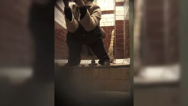 This slut is amazing and you can see her peeing in the public restroom