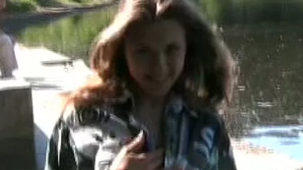 Fantastic lusty young babe shows off her big breasts and sexy ass by the lake