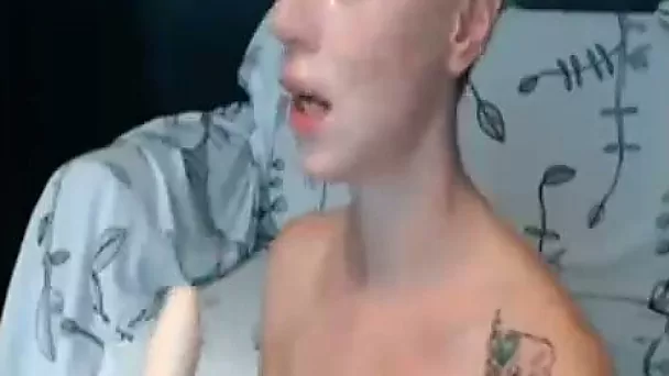 Filthy tattooed webcam slut is destroying her throat with her dildo