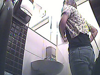 Long haired gorgeous blonde girl pisses in the public restroom