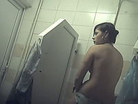 Lovely white teen brunette filmed from behind in the shower