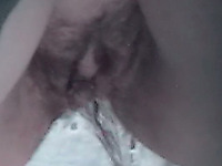 Hairy pussy of an amateur lady filmed closeup on hidden cam