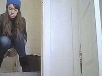Slender white young lady in the public restroom pissing on hidden cam