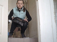 White chick in the toilet gets filmed on cam when she pisses