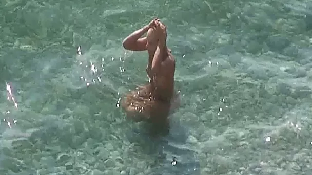 Blonde fine amateur white chick with gorgeous butt on the nudist beach