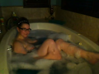 Kinky nerdy bosomy MILFie babe takes a foamy bath for me on webcam