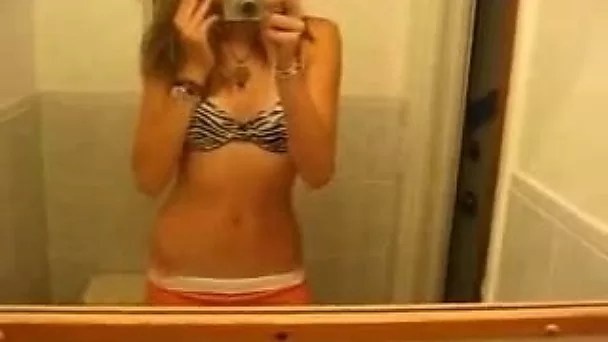 Slender pretty blonde girl flashed her small tits while stripping on webcam
