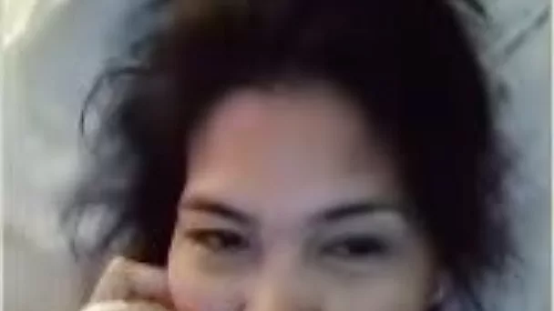 Messy haired a bit lazy but quite nice Asian girl was playing on camera