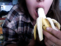 Kinky cam chick acted playfully while sucking banana like a real dick