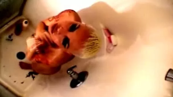 Busty short haired blonde babe filmed washing in the shower room