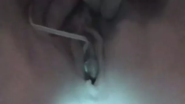 Amateur chick examines her pussy with kinky thingy
