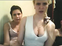 Two naughty blonde and brunette girls were posing in their white tank tops