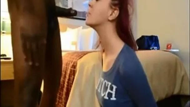 Red haired webcam cutie in blue T-shirt was sucking massive black cock