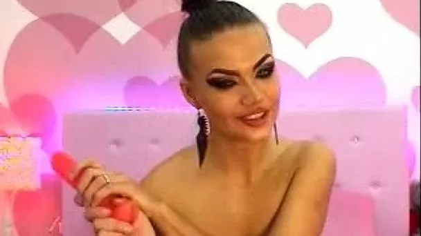 Lewd webcam whore with too heavy makeup played with sex toy