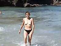 Kinky ugly skinny bitch exposes her small tits outdoors on the beach