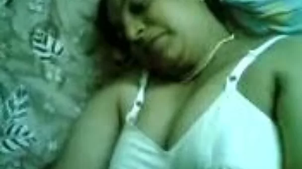 Fat nasty Indian whore lies on her back demonstrating me her huge tits and beaver