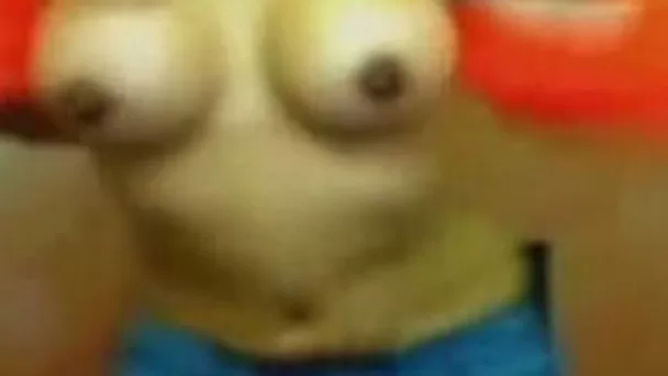 Just a latina on webcam with seemingly fake titties