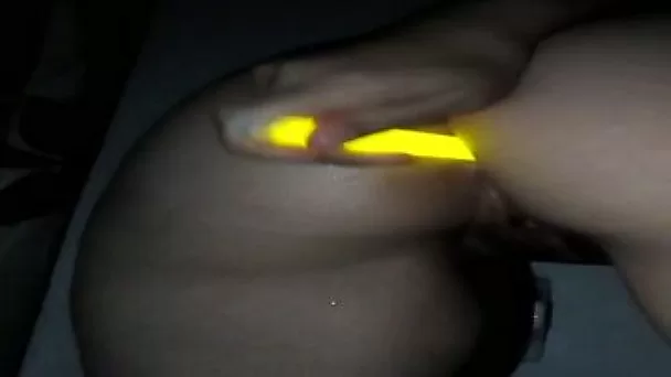 Using a bright glittering dildo slutty cam nympho pets her anus