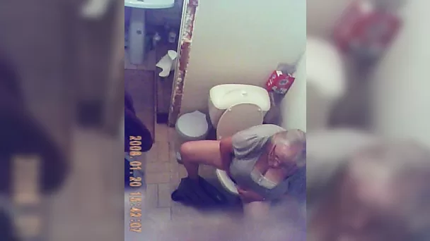 Horny granny gets caught on tape by me when peeing in the toilet room
