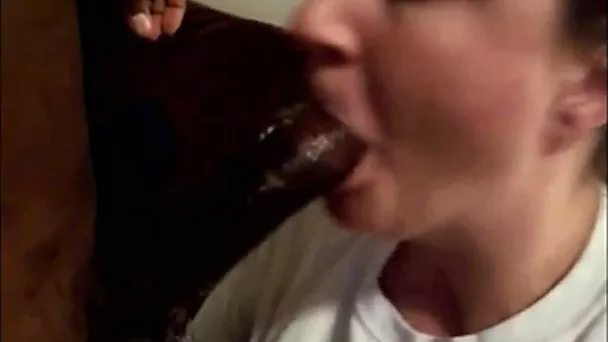 This sexy chick knows how to service a cock and she loves black cock