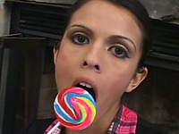 Wonderful sexy looking buxom brunette teases her twat with a lollipop