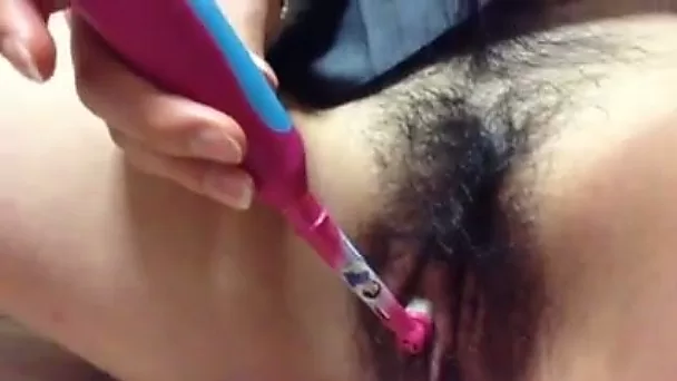 Using electric tooth brush slutty webcam whore teases her hairy cunt