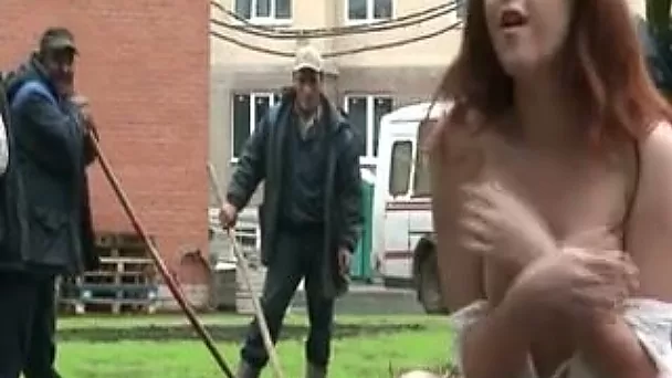 Sizzling redhead babe with stunning body flashes her pretty pussy in public