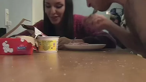 Bodacious Russian brunette hoe takes a snack before exposing her cunt