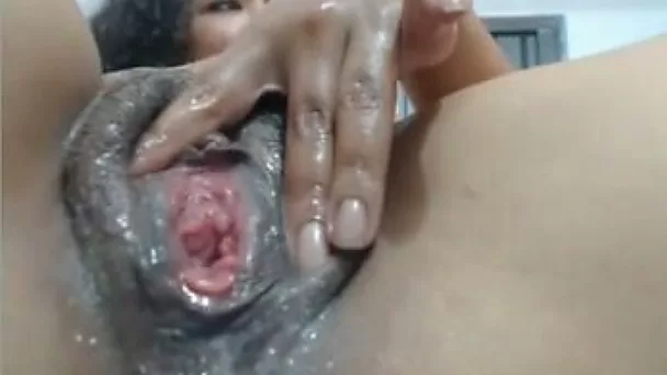 Lewd curly haired amateur Latina bitch fists her own lubed creamy cunt