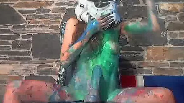 This webcam girl is covered in paint as she rides her dildo like crazy