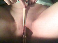 Squeezing my clit and loose pussy lips with china-sticks