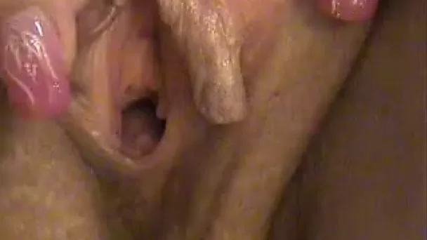 Playful chick in pink stockings is toying her pussy