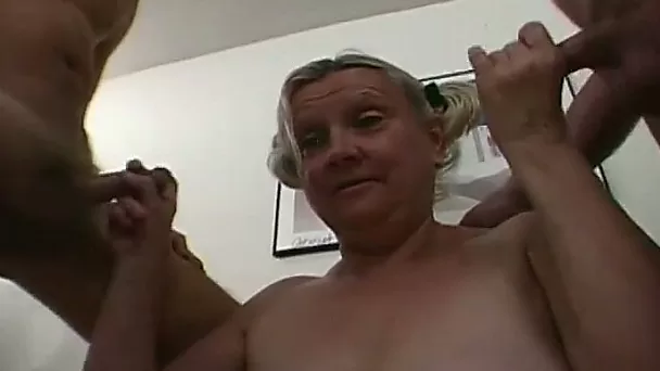 Mature extremely fat lady with saggy tits works on two massive dicks