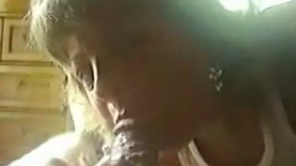Hefty blonde prostitute with huge tits gives me a blowjob