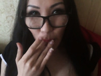Sexy Asian shemale in glasses loves jerking and sucking cock
