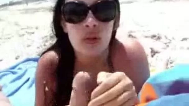Beautiful brunette babe is sucking my big dick on a beach