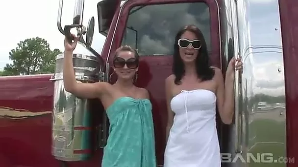 Seductive shapely ladies flash their butts and tits next to big trucks