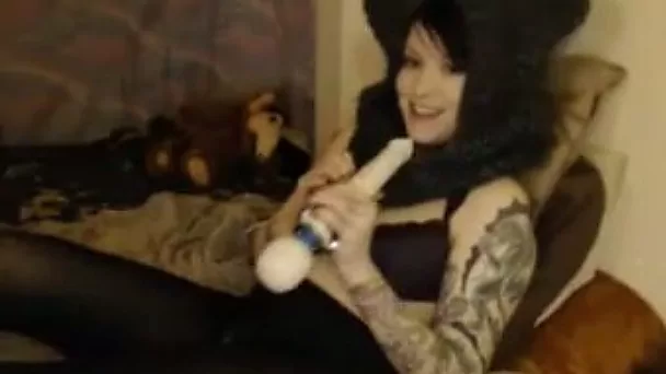 She likes to tickle her twat with her Hitachi vibrator through her pantyhose