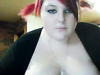 Ardent red haired BBW toys her bald vagina in front of webcam