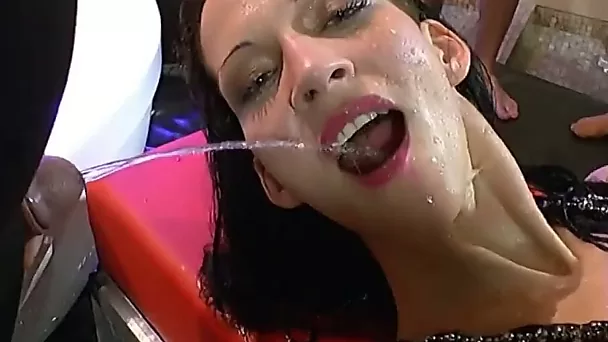 European babe enjoys getting pissed on at bukkake