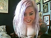Tattooed big breasted webcam blondie plays with her huge boobies