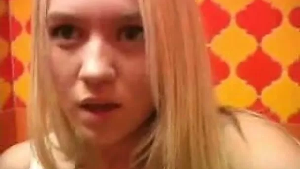 Sitting on the toilet bowl amateur chick masturbates wet pussy