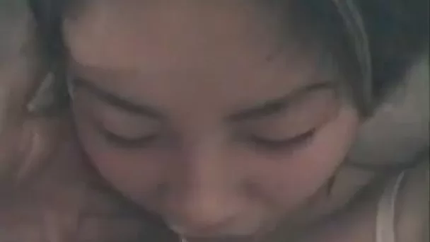 Svelte Asian slut closes her eyes while tenderly sucking my buddy