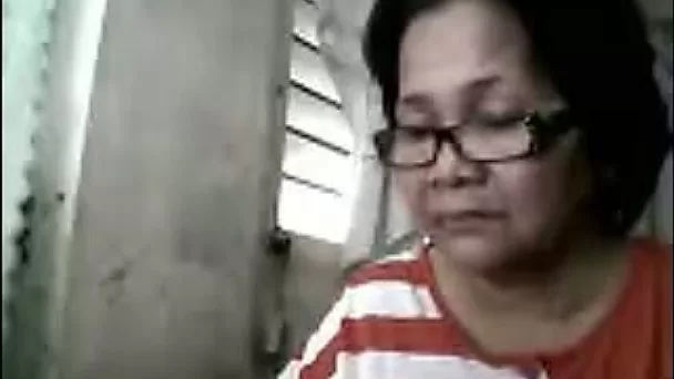 Lustful 61 yo Asian granny fondles her pussy on webcam
