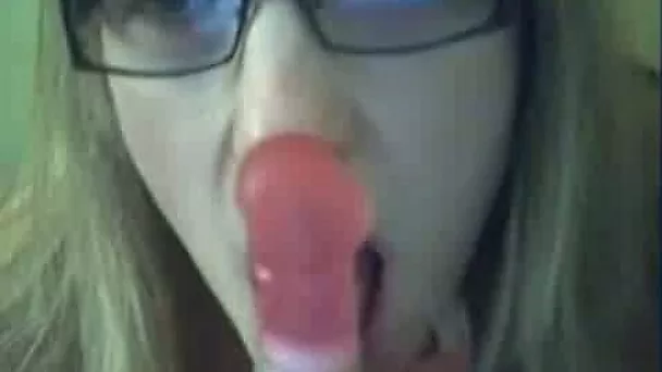 Filthy blonde slut with glasses pokes her twat with dildo