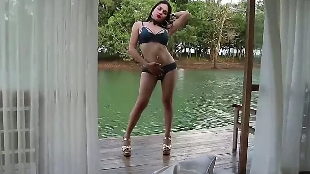 She may look like a classy lady but she's got a surprise between her legs