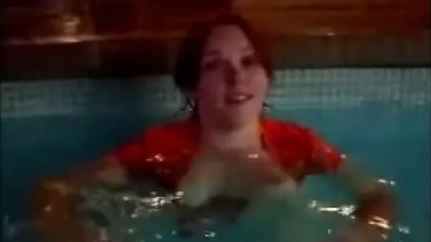 Just a busty redhead teen chick in the pool flashing