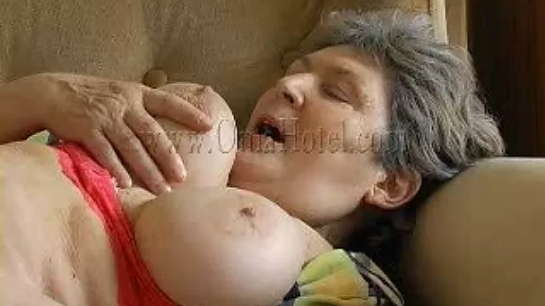 Old and obese granny on the couch masturbates on cam