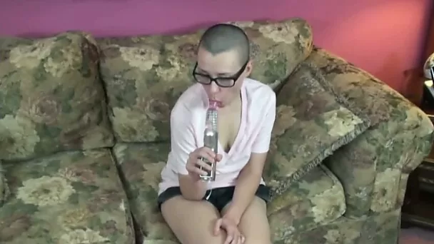 Bald head chick in glasses pets her hairy cunt with shiny vibrator